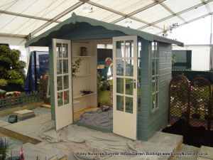 Petersham Bespoke 8x5 summerhouse with Wild Thyme Finish on display at The Hampton Court Flower Show.